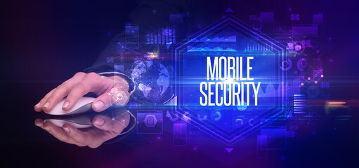 hand holding wireless peripheral with MOBILE SECURITY inscription, cyber security concept