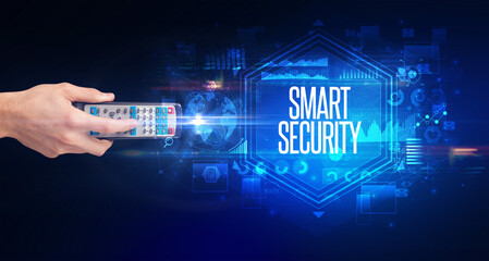 hand holding wireless peripheral with SMART SECURITY inscription, cyber security concept
