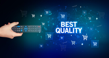 hand holding wireless peripheral with BEST QUALITY inscription, online shopping concept