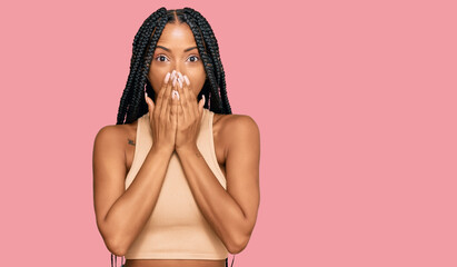 Beautiful hispanic woman wearing casual clothes shocked covering mouth with hands for mistake....