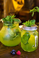 Refreshing mint lemonade in decanters to serve in a restaurant. Still life.