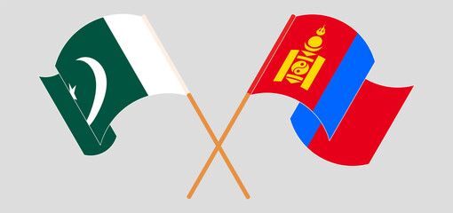 Crossed and waving flags of Pakistan and Mongolia