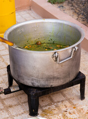 Cooking Chicken Machboos in a big Pot 