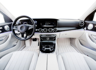 Luxury car interior. Steering wheel, shift lever and dashboard. white leather interior with black...