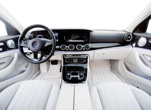 Luxury car interior. Steering wheel, shift lever and dashboard. white leather interior with black dashboard. on an isolated white background