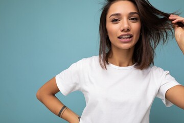 Attractive beautiful pretty charming fascinating young brunette woman in casual white t-shirt for...