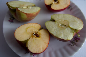 Halves of two sliced apples.