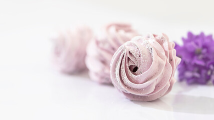 Handmade marshmallow with blueberries, white background. Violet Marshmallow, Meringue, Zephyr.