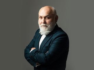 Bearded middle-aged man with a serious expression in a closeup head and shoulders portrait. Serious...