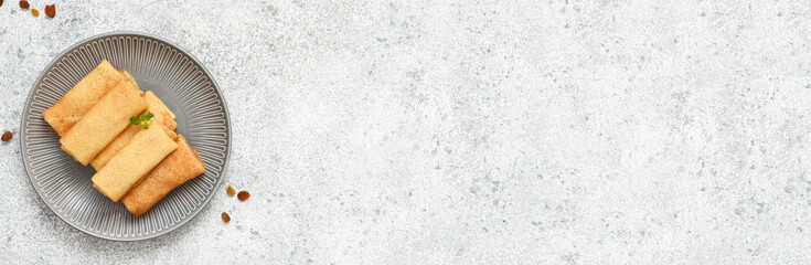 Thin pancakes with filling on a concrete background. Platbands. A traditional dish of Belarus and Ukraine. View from above.