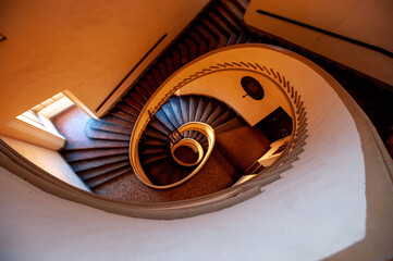View of a wood spiral staircase.