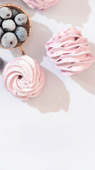 Handmade marshmallow with blueberries, white background. Violet Marshmallow, Meringue, Zephyr.
