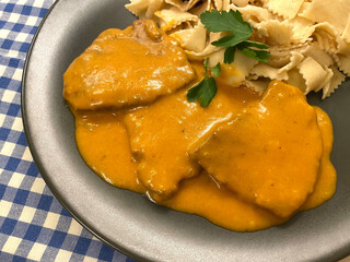 Beef escalope with mustard in carrot, tomato paste, sour cream gravy. Served with Tagliatelle.