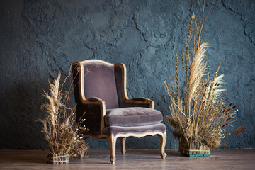 armchair in the interior against a gray wall