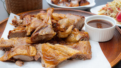 Roasted duck, salt, crispy skin. Crispy golden crispy duck like fried food to dry. Grilled or Baked Chicken for eating with Papaya Salad, sticky rice, a popular lunch among Northeastern Thai people.