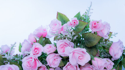 Pink rose bouquet Put on a white surface For making frames and background in the concept of Valentine's Day. A fake bouquet made of cloth and plastic.