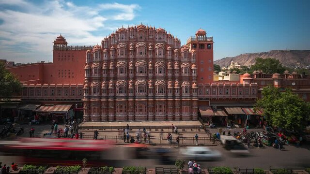 Daytime time lapse view of historical landmark Hawa Mahal aka Palace of the Winds located in the Pink City of Jaipur in Rajasthan, India.