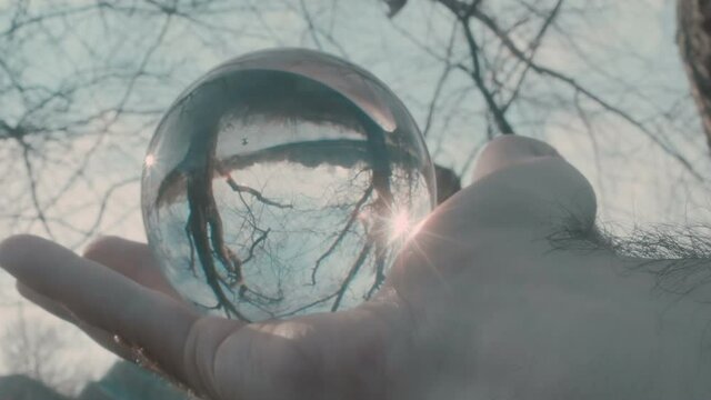 crystal ball outside in hand