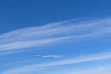 Naklejka na ściany i meble Skyscape blue sky and clouds. A skyscape with summer blue sky and clouds