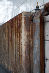 Locker room of an old industrial factory: Old rusty radiator