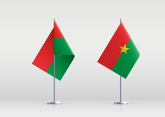 Burkina Faso flag state symbol isolated on background national banner. Greeting card National Independence Day of the Republic of Burkina Faso. Illustration banner with realistic state flag.