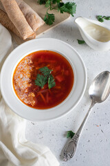 borsch with bread sticks and sour cream