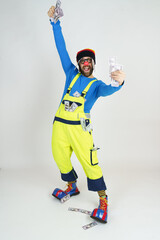 Clown in a bright suit holds money in his hands