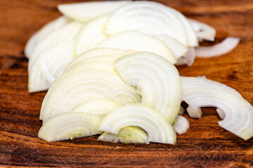 white onion sliced on wood planks, Onions