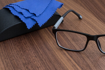 black glasses on a wooden table
