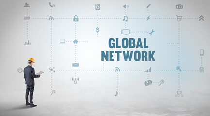Engineer working on a new social media platform with GLOBAL NETWORK inscription concept