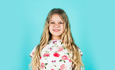 Hairdresser salon. Enjoy silky hair. Adorable small child. Pretty girl curly hair blue background. Beautiful little model. Healthy curls. Easy hairdo. Beauty supplies. Perfectly untangle curly hair