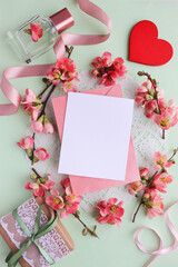 happy valentine's day card. spring flowers on white background and red heart