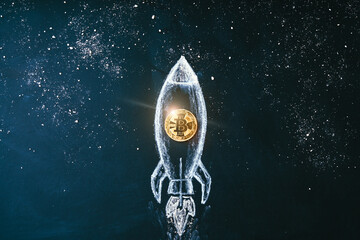 Bitcoin logo rocket launcher, cryptocurrency concept. The growth rate of the gold coin for...