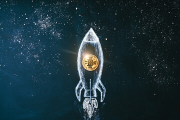 Bitcoin logo rocket launcher, cryptocurrency concept. The growth rate of the gold coin for...
