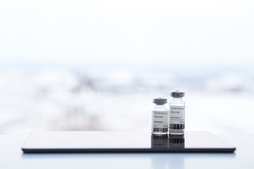 Covid-19 vaccine two small ampoules with two-component vaccine stand on a table