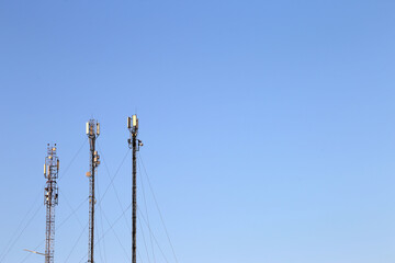 Obraz premium three antennas against the sky