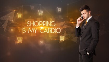 Businessman with shopping cart icons and SHOPPING IS MY CARDIO inscription, online shopping concept