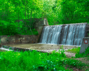 dam on the river creates waterfall