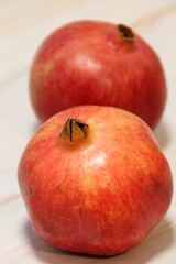 ripe red pomegranate, pomegranates, two pomegranates one after the other