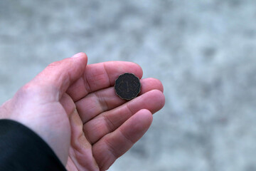 Old coin from india one anna in hand