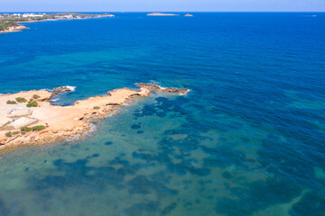 Fototapeta na wymiar Aerial photo of the beautiful island of Ibiza in Spain showing the ocean on a clear sunny summers day