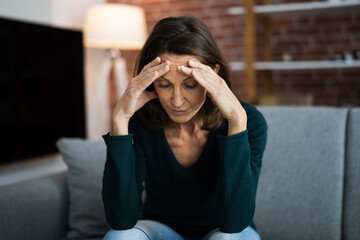 Depressed Sad Young Girl With Headache Sitting
