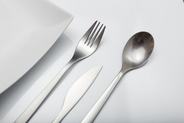 Minimal designed inox cutlery isolated on white background