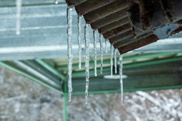 icicles on a roof, icicles hanging from a roof