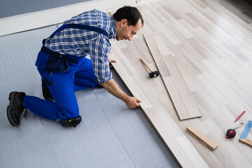 Worker Installing Home Floor