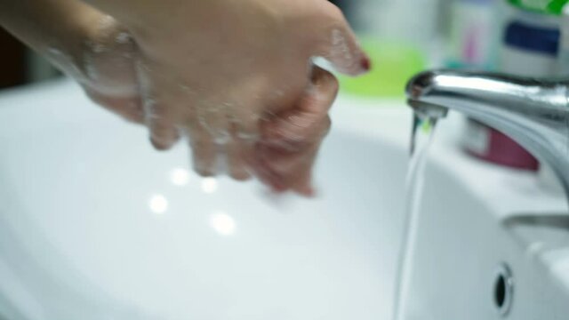 Woman washing Hands with sanitiser soap in covid-19 pandemic disease,health care