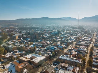 Fotobehang Vladikavkaz, capital of North Ossetia. Panorama of historical downtown from drone flight © Mulderphoto