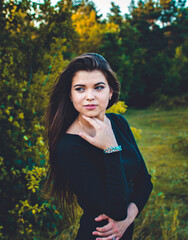 portrait of a girl walking on forest paths. beautiful look and fascination with beauty