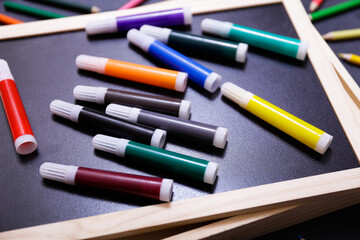 markers and dark background. 