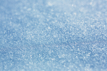 Close-up of snow texture in winter on the banks of a frozen river.